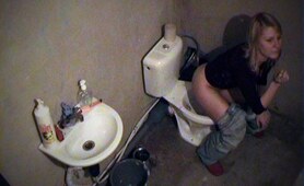 Sweet doll pissing and smoking on the toilet-bowl!